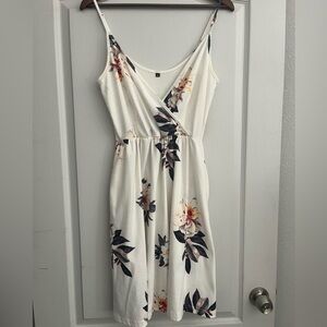 Floral White Knee Length Spaghetti Strap Dress with Pockets!